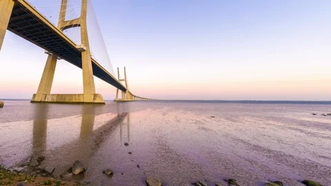 Sunset over the Vasco da Gama Bridge in Lisbon Stock Footage 91571577