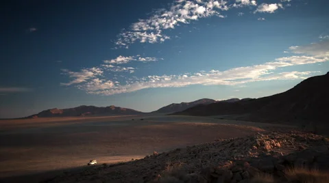 SUNSET OVER VAST PLAIN WITH ATV HD Stock Footage 45343890