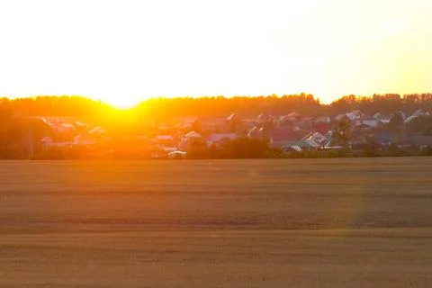 Sunset over the village Stock Photos