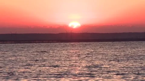 Sunset over the water body Stock Footage 243931538