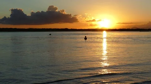 Sunset Over Water With Clouds Stock Footage 76204503