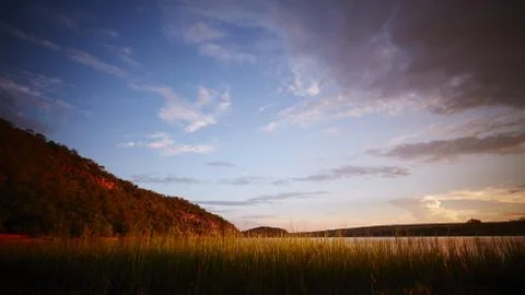Sunset over water Stock Photos