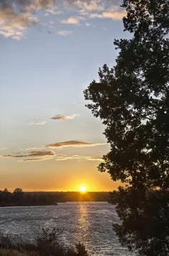 Sunset over the water Stock Photos