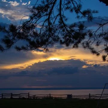 Sunset over the water Stock Photos