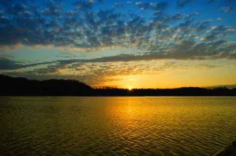 Sunset over water Фото