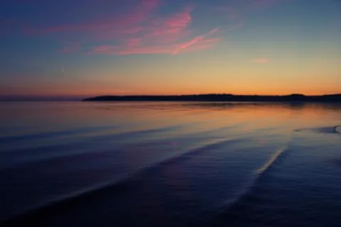Sunset over the water Stock Photos