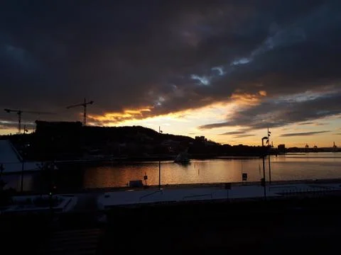 Sunset over the water Stock Photos