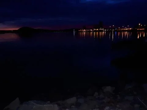 Sunset over the water Stock Photos