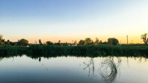 Sunset over the water Stock Photos