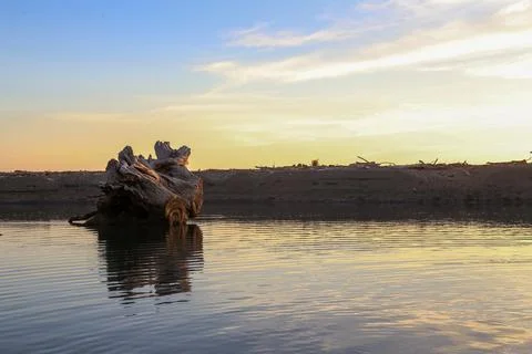 Sunset over the water Stock Photos
