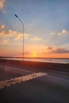 Sunset over the water Stock Photos