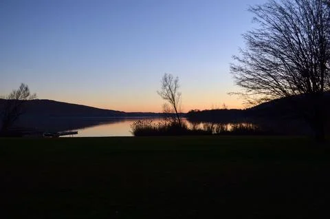 Sunset over the water Stock Photos