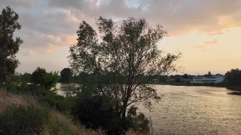 Sunset over water. red sunset sun. 4k video and 24 fps. sunrise on the lake.. Stock Footage 314043462