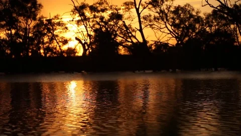 Sunset over water - reflections Stock Footage 72107734