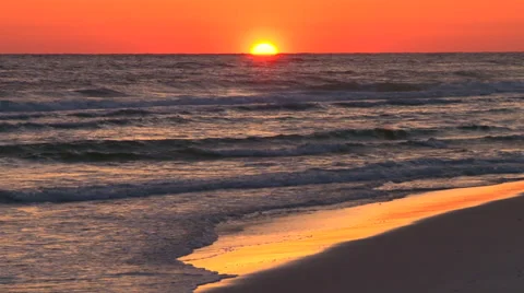 Sunset over water on a sandy beach Stock Footage 38175578