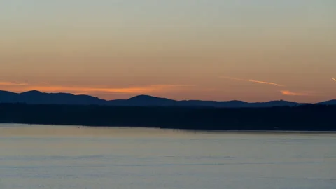 Sunset over water time lapse Stock Footage 132919595