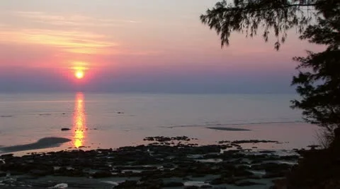 Sunset over water - timelapse 库存影片 11344556