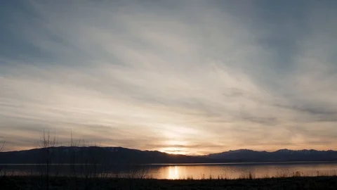 Sunset over water timelapse Stock Footage 87155463