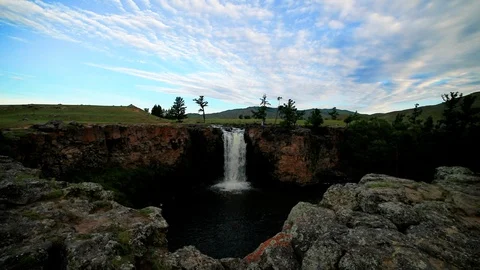 Sunset over waterfall Ulaan Tsutgalan, Mongolia Stock Footage 123772607