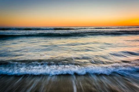 Sunset over waves in the Pacific Ocean, in Santa Monica, California. Stock Photos