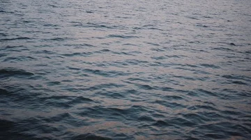 Sunset over the waves of the sea of galilee Stock Footage 86071346