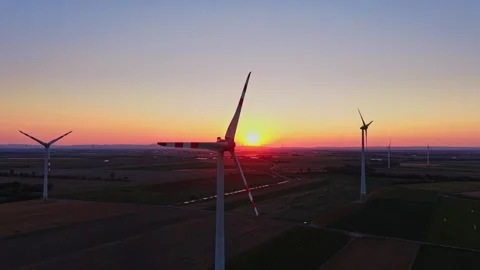 Sunset over wind turbines in a rural area Stock Footage 342609561