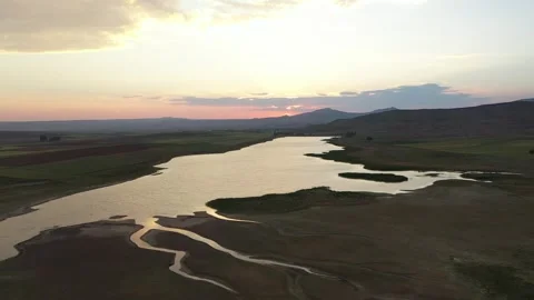 Sunset Over Winding Water Channels In Dried Lake Basin Stock Footage 324700775