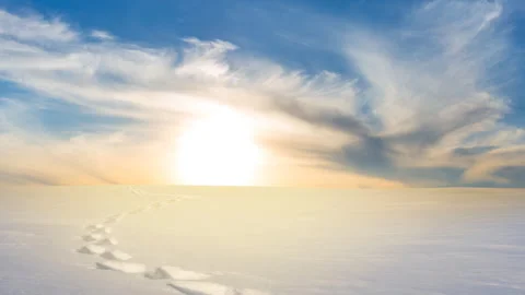 Sunset over a winter snowbound plain Stock Footage 330115797