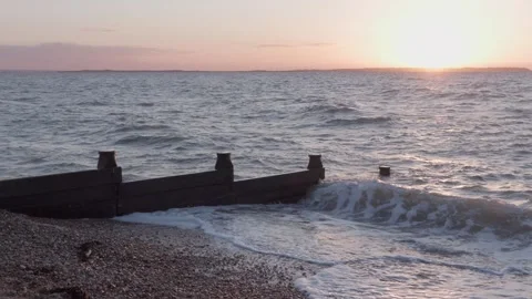 Sunset over Witstable beach, Whitstable, Kent, England, UK Video stock 335702824