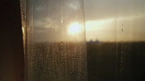 Sunset. Overcast Weather. Raining. Drops of Rain Flow down the Glass. Sunset Stock Footage 196202748