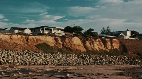 Sunset Overlooking Cliffside Properties at Adelaide Beach Cinematic 4K 24fps Stock Footage 303731596