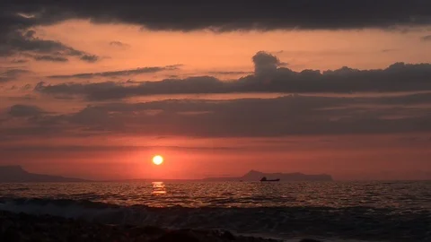 Sunset overlooking the mountain and boat on the seashore Stock Footage 100506388