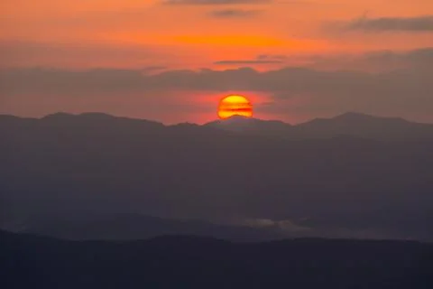 Sunset overlooking mountains with Mist Stock Photos
