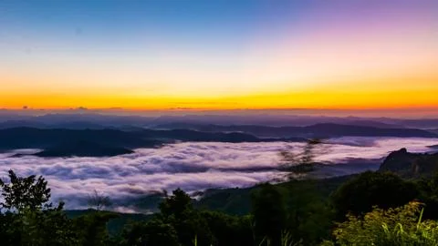 Sunset overlooking mountains with Mist Stock Photos
