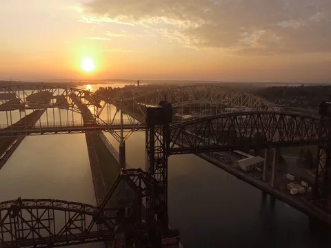 Sunset overlooking Sault Ste Marie International Bridge on St Marys River Stock Footage 80895762