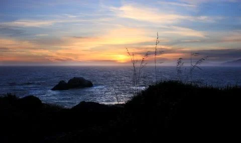 Sunset at pacific coast Stock Photos