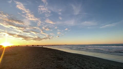 Sunset painted the sky, while the waves told the story Stock Footage 341876493