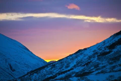 Sunset paints the evening sky in spring in the mountains of Kamchatka Stock Photos