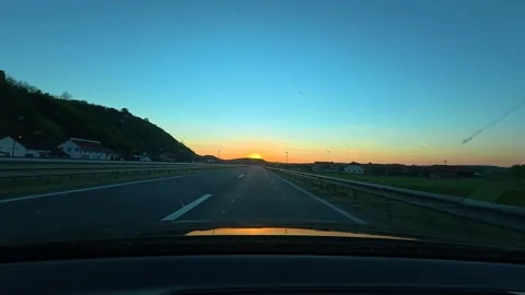 Sunset paints sky in calm orange glow. Balkan, Eastern Europe, POV Video stock 333590412