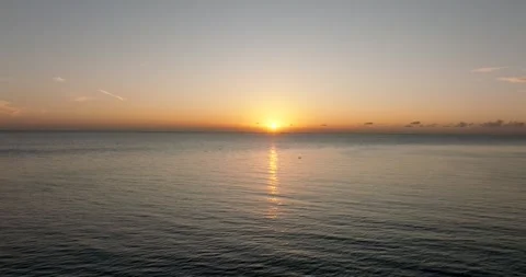 The sunset paints the sky over the tranquil lake with a warm afterglow Stock Footage 274736644