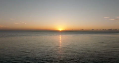 The sunset paints the sky over the tranquil lake with a warm afterglow Stock Footage 274956135