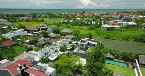 The sunset paints the sky over the tranquil ocean with a warm afterglow Stock Footage 281087919