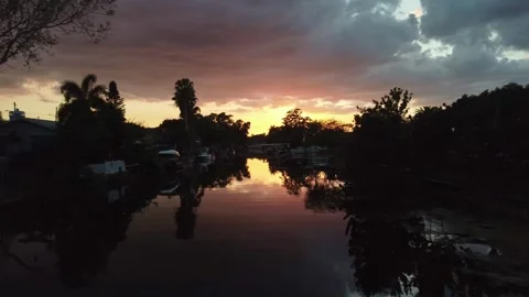 Sunset in Palm Harbor, Florida along a houses estate river. The footage moves Stock Footage 342221505