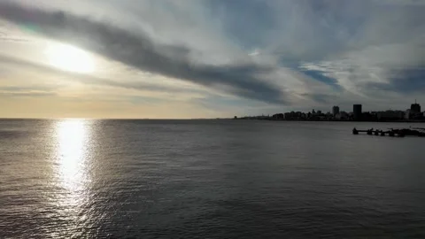 Sunset pan of Playa Ramirez beach and Rio de la Plata, Montevideo Stock Footage 341771826