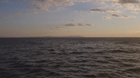 Sunset pan from the side of a ship of the mediterranean sea Stock Footage 108602586