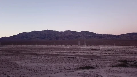 Sunset panning desert with silhouette mountain Stock Footage 81574845