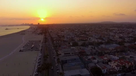 Sunset panning over beach town. Stock Footage 94424142
