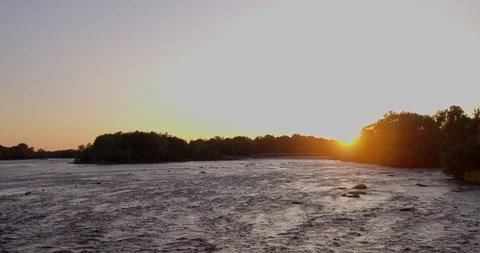 Sunset panning / tilting view of river Stock Footage 115131751