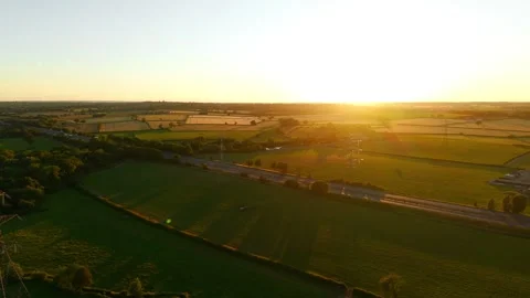 Sunset panorama above patchwork farmland and countryside horizon. Rural Stock Footage 340195559