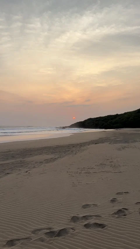 Sunset Panorama Over Sandy Beach and Ocean Waves, Panning Wide Shot, Vertical Stock Footage 324770552